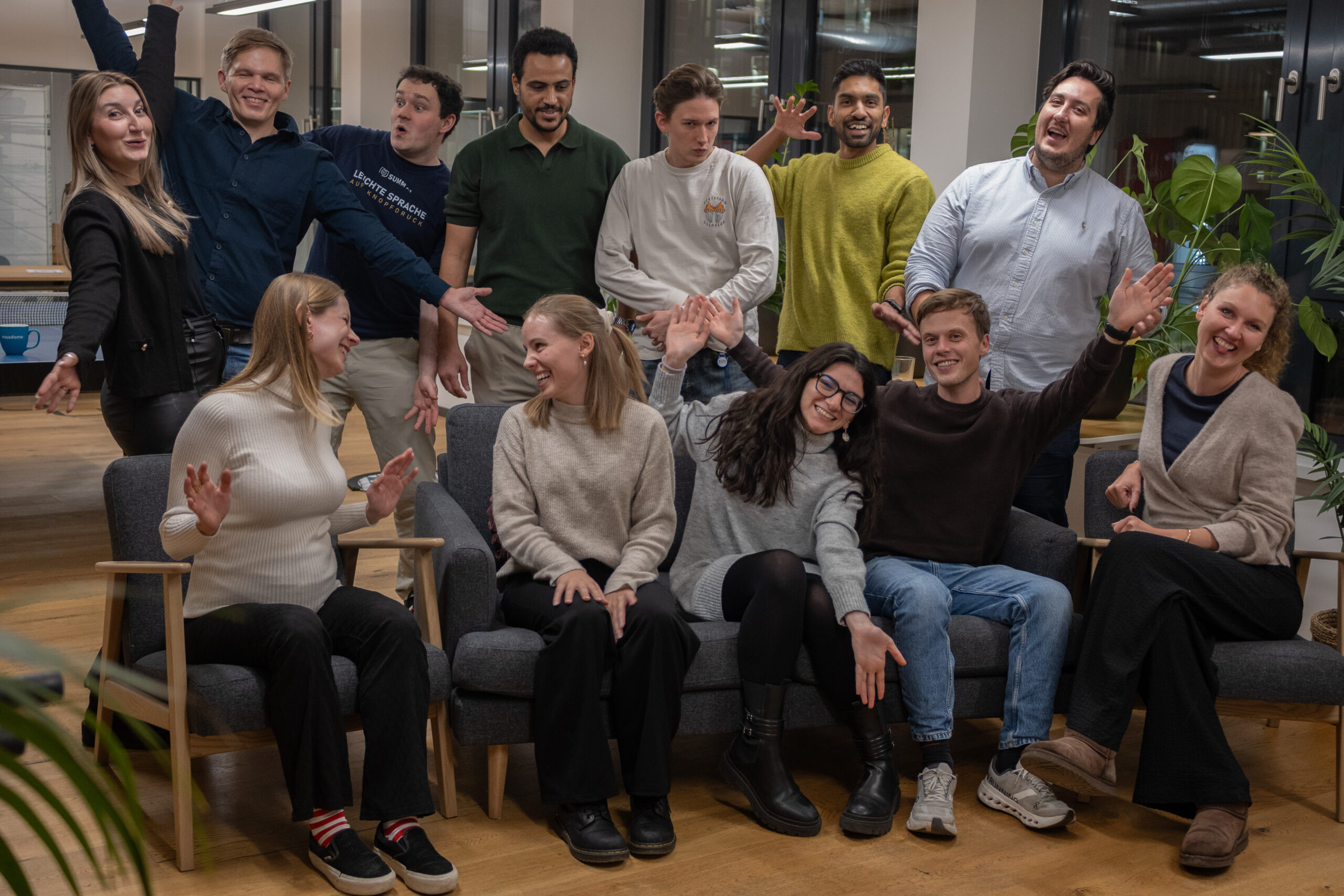 This is a picture of the SUMM team. Eight people laugh for the camera. There are three men and five women.